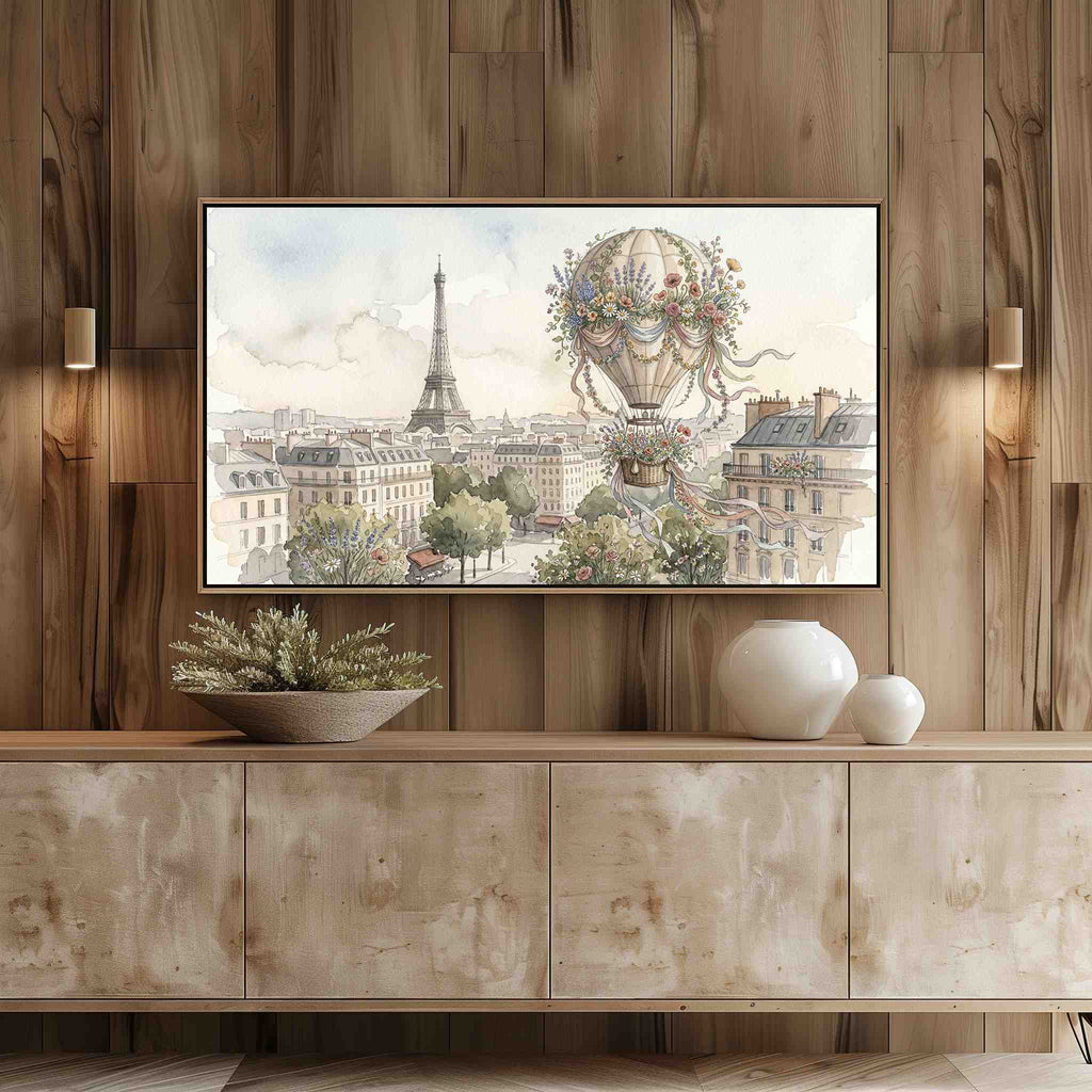 Frame TV showing a whimsical floral hot-air balloon Paris watercolor above a light wood entertainment center